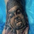 Black ink Hinduism style medium sized foot tattoo of Buddha statue