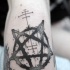 Black ink medium size devils star tattoo on leg