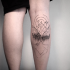 Black ink medium size leg tattoo of forest with mountains and planets