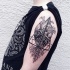 Black ink original designed shoulder tattoo of human heart with ornaments