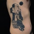 Black ink side tattoo of woman with stone cross and dark moon