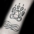 Black ink strange looking paw print with Infinity symbol