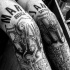 Black ink various styles lettering tattoo on legs