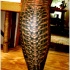 Black spine tattoo on leg