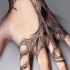 Black tree tattoo on wrist