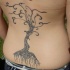 Black tribal tree tattoo