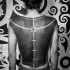 Black work style large ornaments tattoo on back