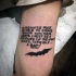 Blackwork style typical lettering tattoo with small Bat