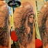 Breathtaking natural looking shoulder tattoo of Indian woman with wolf