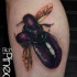 Breathtaking very detailed 3D flying bug tattoo on leg combined with woman lips