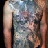 Breathtaking very detailed colored Mayan tribes themed tattoo on whole chest with lettering