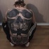 Breathtaking very detailed whole back tattoo of cool human skull