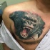 Breathtaking very realistic chest tattoo of roaring gorilla