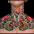 Brilliant designed multicolored chest tattoo if mysterious flower