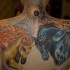 Brilliant looking multicolored fantasy horses tattoo on back and shoulder with nice sun