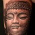 Buddha Gesicht Tattoo