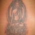 Buddha sitzt auf Lotusblume Tattoo