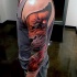 Cartoon like colored demonic lion head tattoo on sleeve