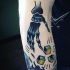 Cartoon style colored arm tattoo of skeleton hand with dice