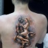 Cartoon style colored back tattoo of devil with naked woman