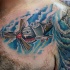Cartoon style colored chest tattoo of fighter plane
