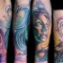 Cartoon style colored forearm tattoo of fantasy woman