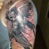 Cartoon style colored shoulder tattoo of angel warrior