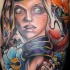 Cartoon style colored tattoo of woman face with snake and flames