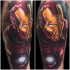 Cartoon style traditionally colored Iron man tattoo on half sleeve zone