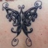 Tatuaje en la espalda, mariposa de estilo celta