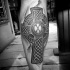 Celtic style black ink leg tattoo of big cross