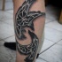 Celtic style colored leg tattoo of flying crows