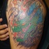 largo drago cinese tatuaggio su braccio