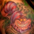 Tatuaje en el hombro, gato de dibujos animados