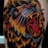 Colored amazing looking thigh tattoo of roaring head