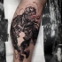 Colored biceps tattoo of very detailed Venom