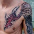 Colored biomechanical style shoulder and chest tattoo of human heart