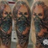 Colored cool looking shoulder tattoo of creepy woman with skull