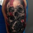Colored creepy looking shoulder tattoo of tribal woman with gas mask