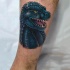 Tatuaje en la pierna, cabeza de Godzilla de comics