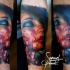 Colored horror style creepy looking arm tattoo of bloody woman