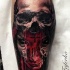 Colored horror style creepy looking leg tattoo of bloody demon with human skull