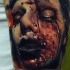 Colored horror style creepy looking tattoo of bloody humans face