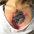 Colored illustrative style chest tattoo of human heart