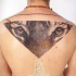 Colored illustrative style upper back tattoo of tiger face