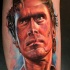 Colored portrait style leg tattoo of famous actor face