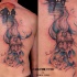 Colored spectacular looking fantasy wizard tattoo on back