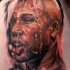 Colored thigh tattoo of famous sports man portrait