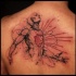 Colored upper back tattoo of fantastic man with red heart