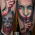 Colorful ankle tattoo of bloody woman with skull